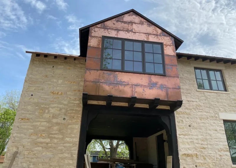 Copper metal panel facade on a stone building for Skylight Installation in Bellbrook